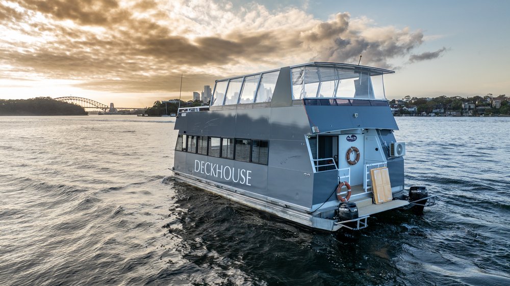 Deckhouse Sydney Harbour boat hire - rear view showing the boarding platform and upper entertaining deck
